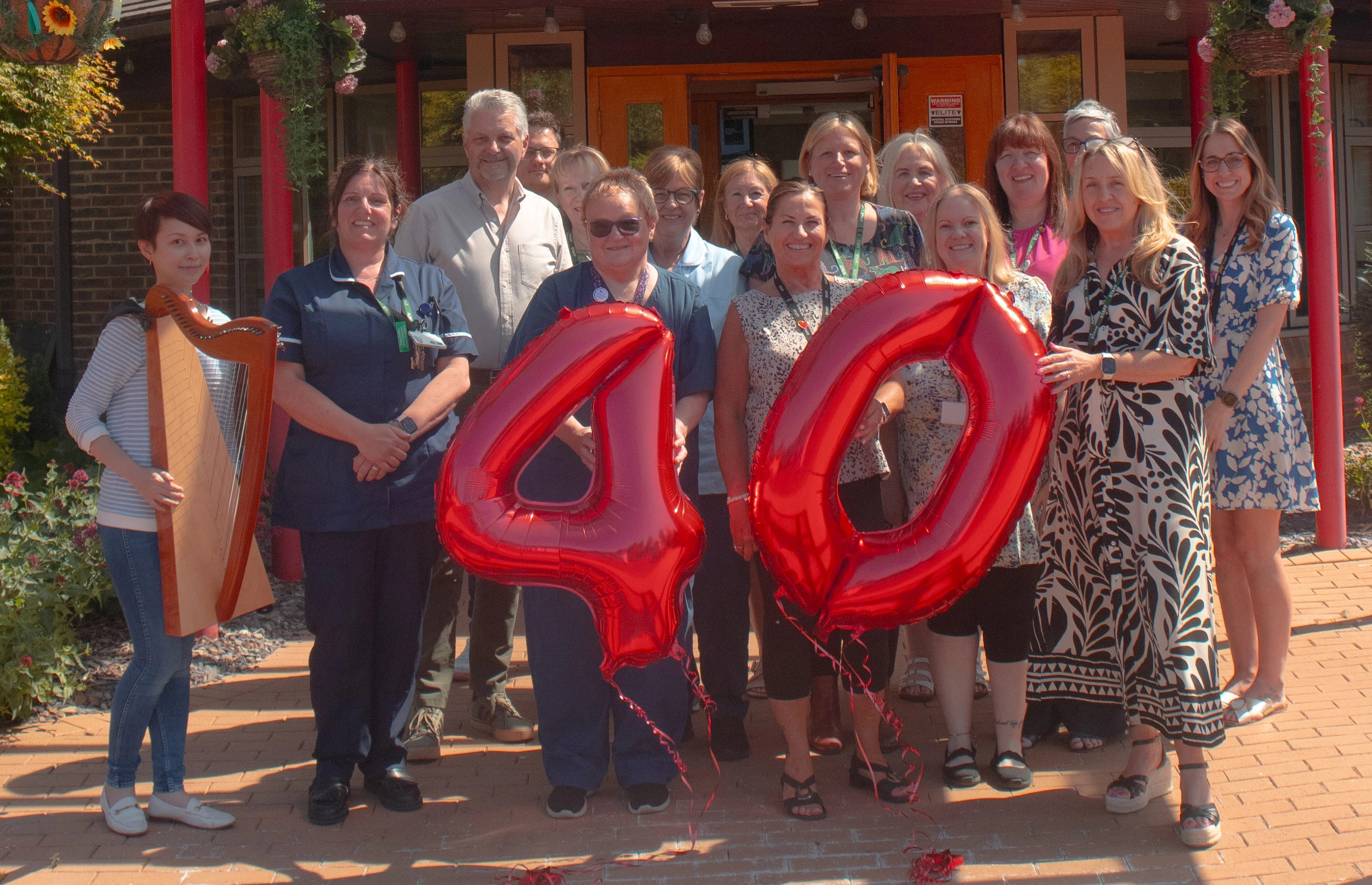 A photo of St. Rocco's Staff grouped together for the 40th Anniversary of the Hospice