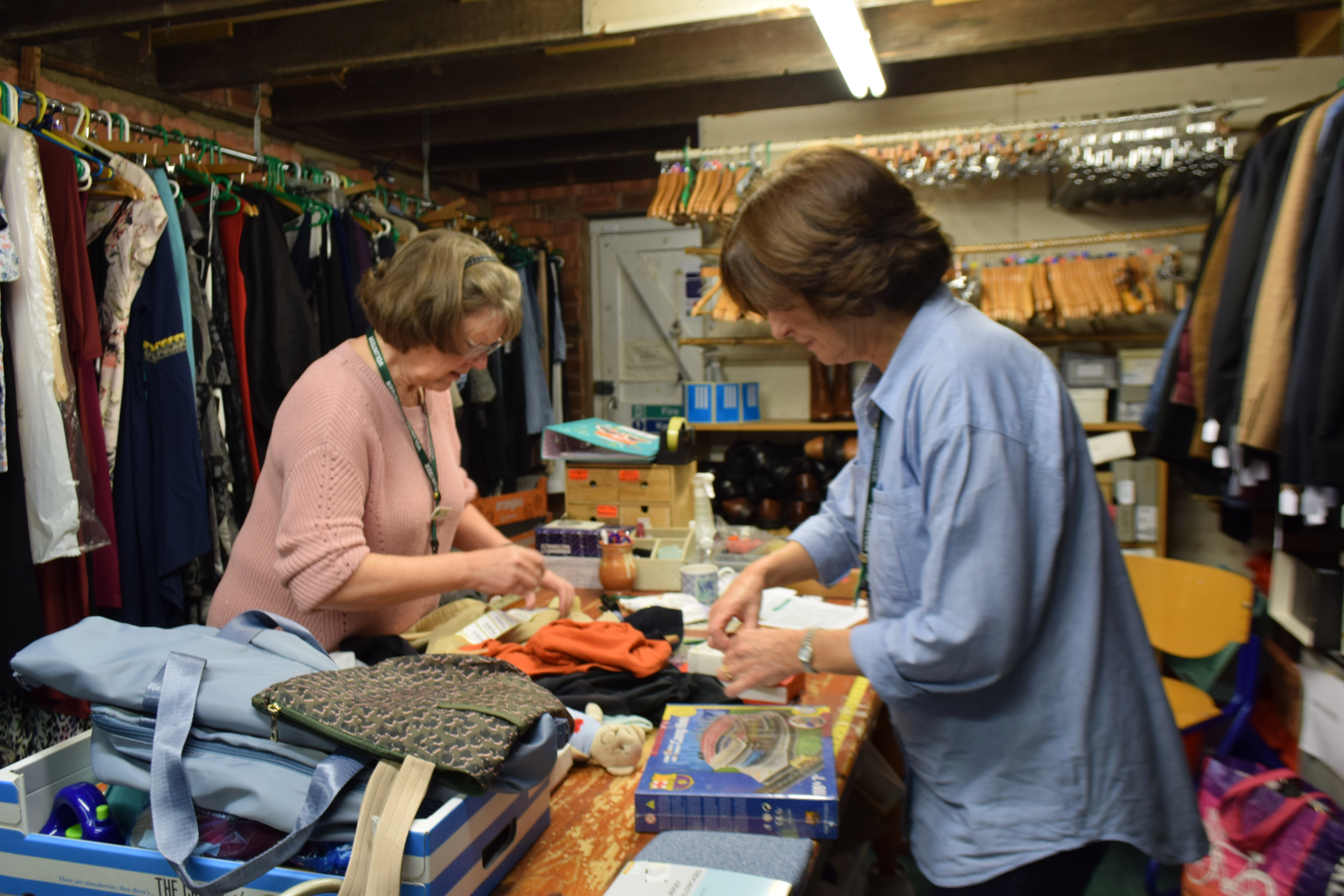 .A shop volunteer sorting stock