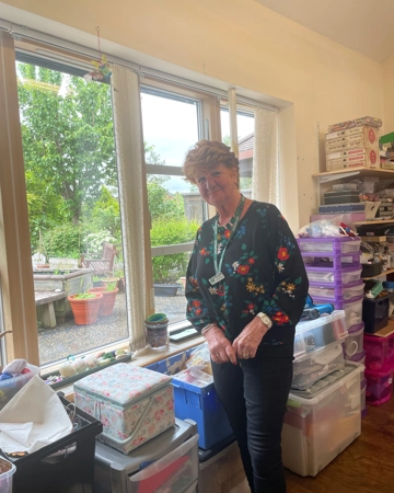 Photo of Volunteer Jacqueline in craft group room