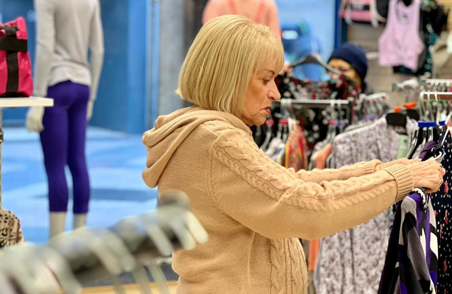 .A photo of a shop volunteer smiling
